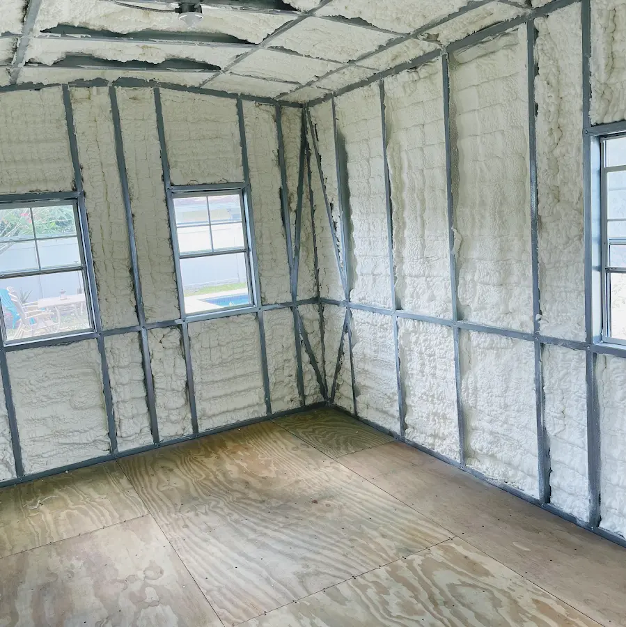 Closed-cell spray foam insulation applied to wall cavities in a residential project in Garland